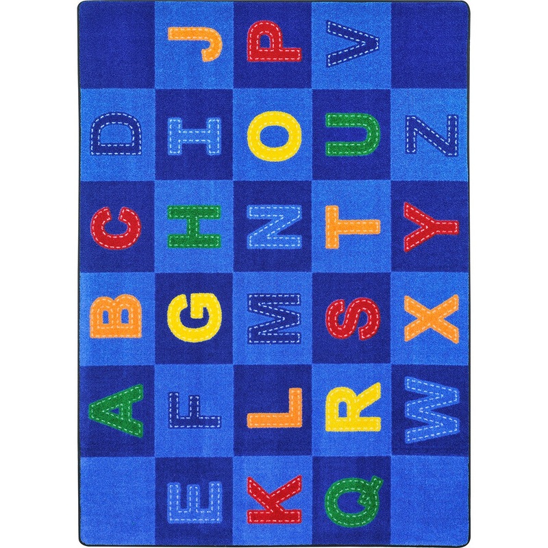 Patchwork Letters 5’4″ x 7’8″ area rug in color Multi